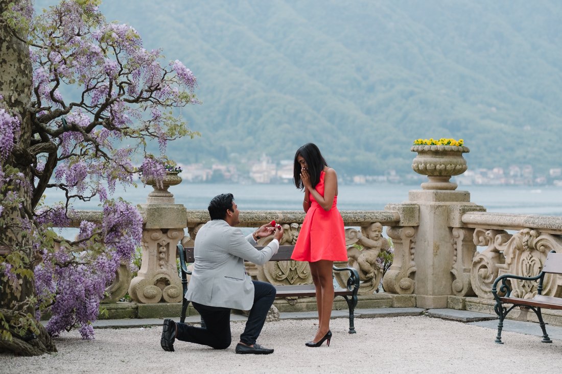 Indian wedding proposal photographer in Villa Balbianello, Lake Como. Groom to be holds out the ring