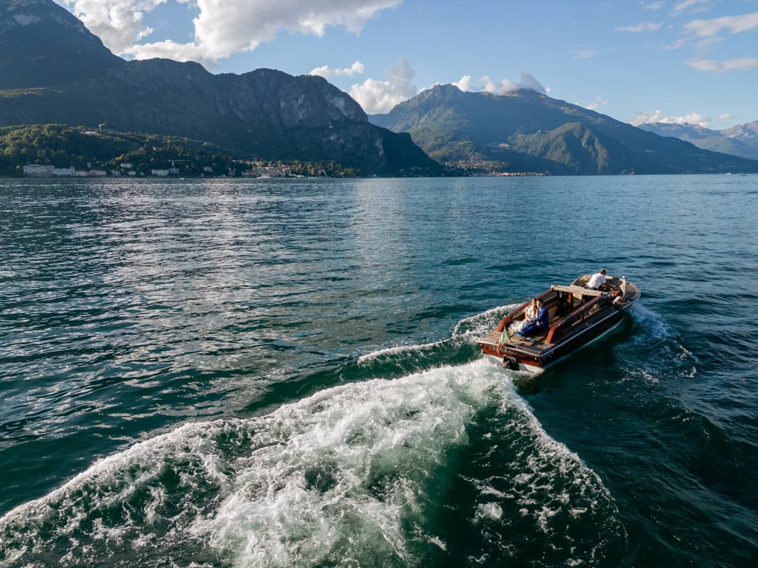 Aerial drone view of a romantic boat proposal on Lake Como