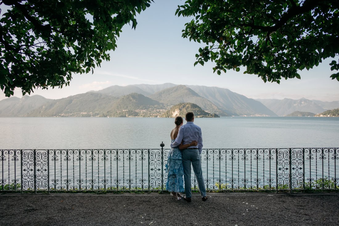 Couple holding hands along the lakefront promenade at Villa Cipressi Varenna