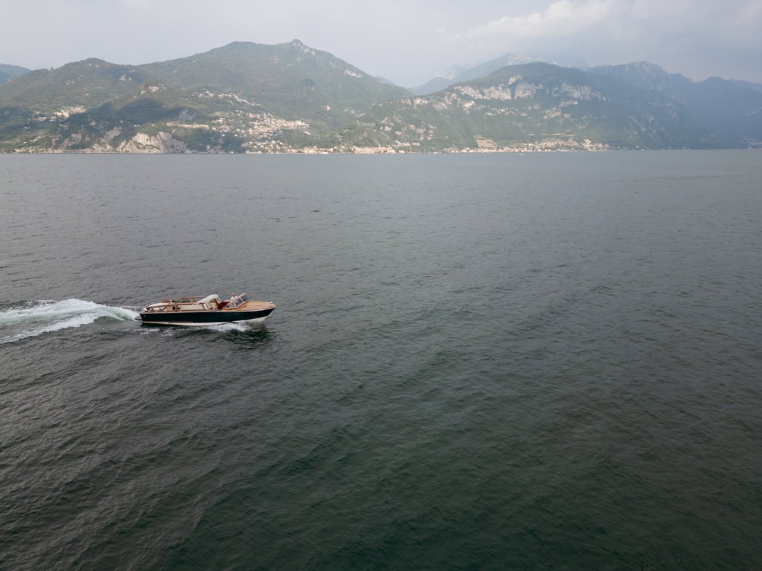 Aerial photograph of a surprise marriage proposal on a private boat Lake Como