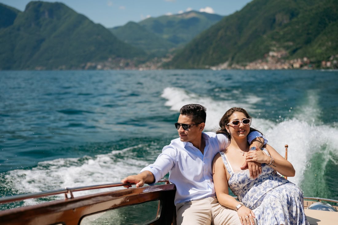 Candid surprise proposal capture on a classic Lake Como speed boat